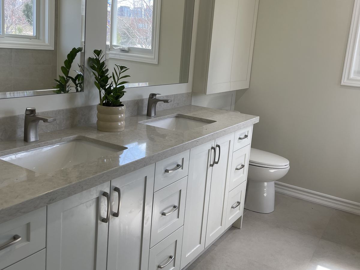 Double vanity and tile floor in a renovated ensuite